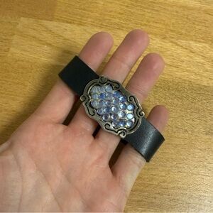 Blue rhinestone on silver tone plate faux leather bracelet
